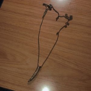 Golden elephant tusk necklace